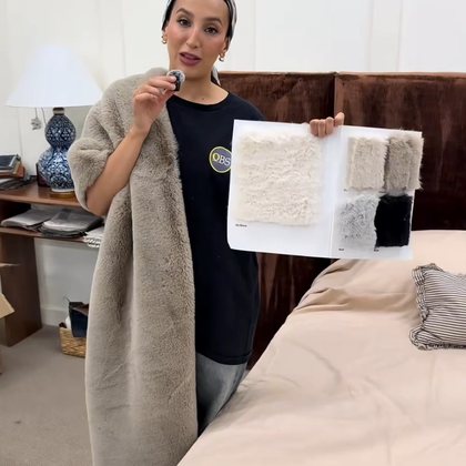 Holding up a soft fabric sample